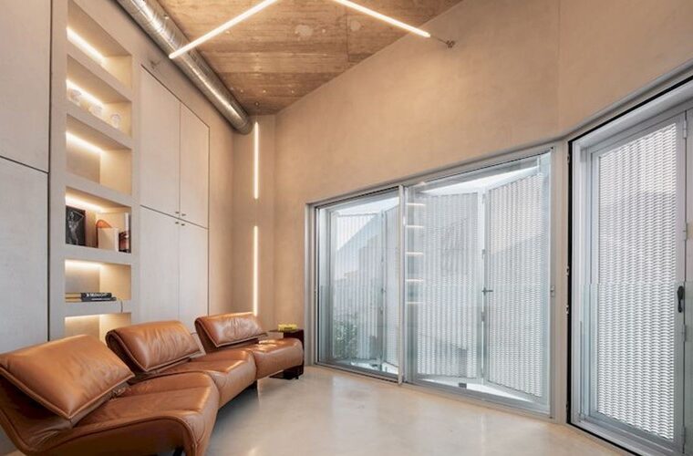 Design-led sea-view townhouse for sale with lift, garage and rooftop terrace in alcudia